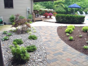 Pool Landscaping with stone and gravel - Westminster Lawn
